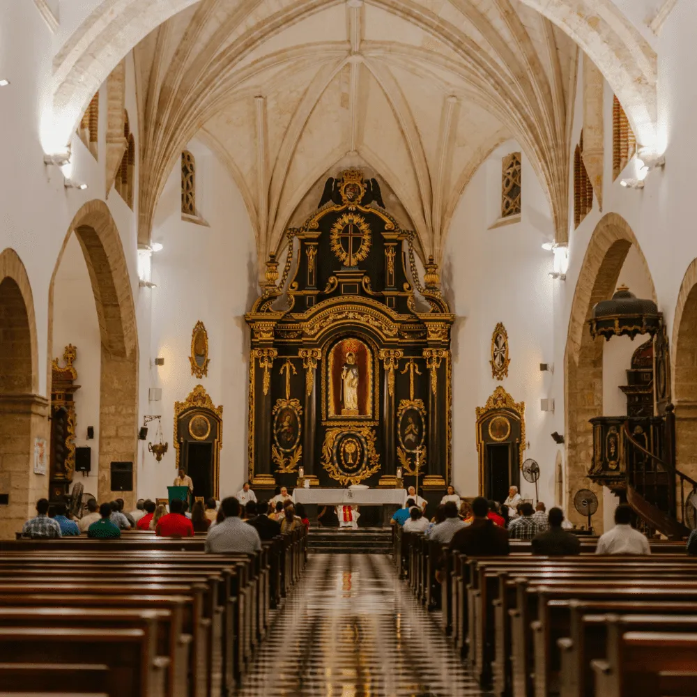 A church with many empty pews during Mass
